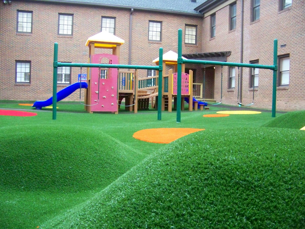 Hilly artificial turf playground by Southwest Greens Charlotte